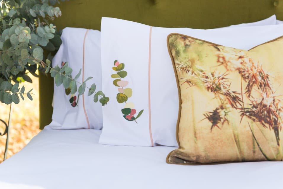 Embroidered pillowcases with a botanical print cushion