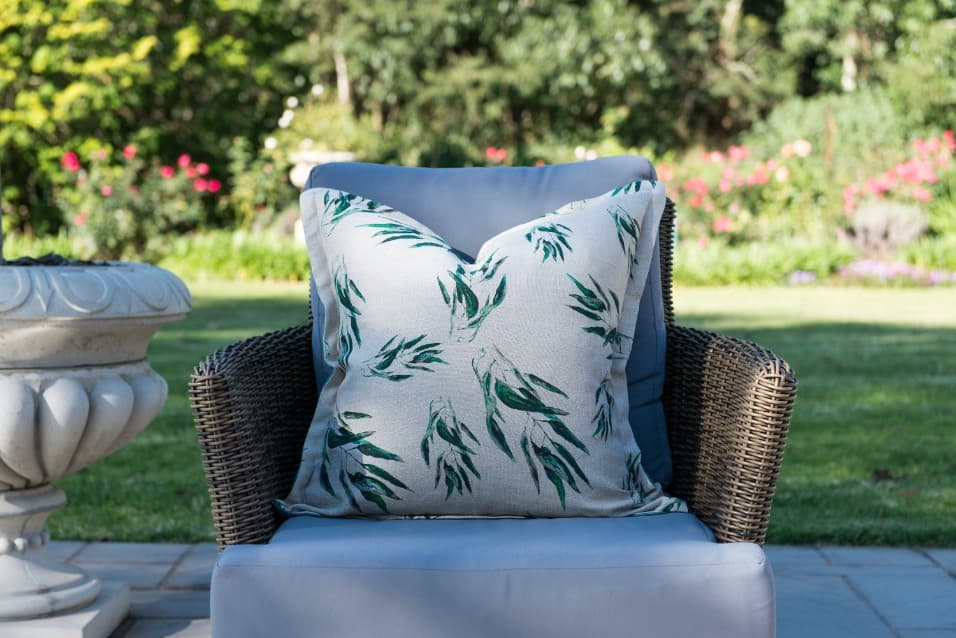 Gum-leaf print cushion on a garden chair
