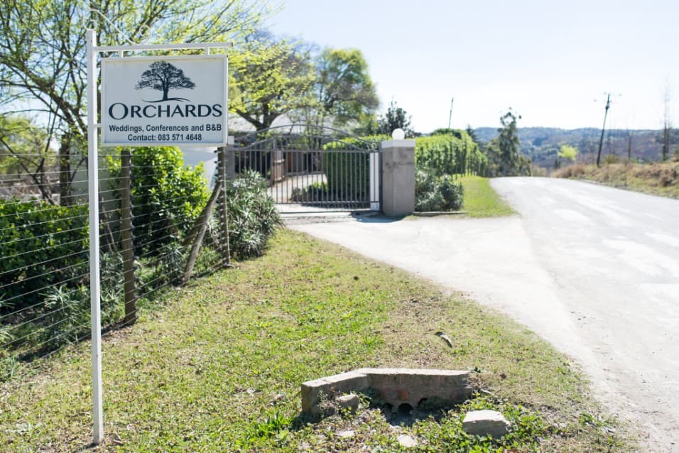 Orchards entrance sign at a country gate