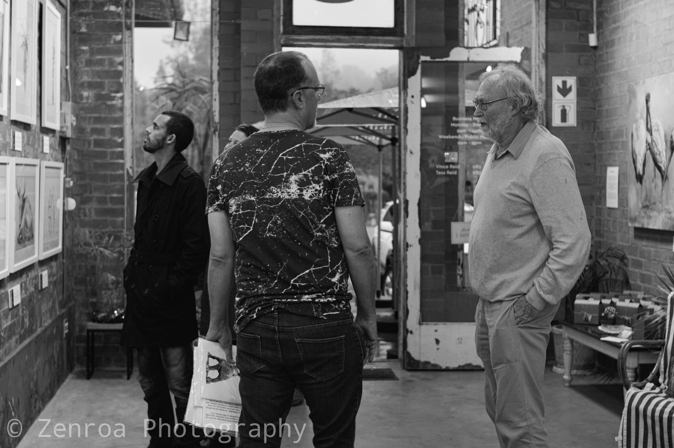 Visitors talking in the gallery