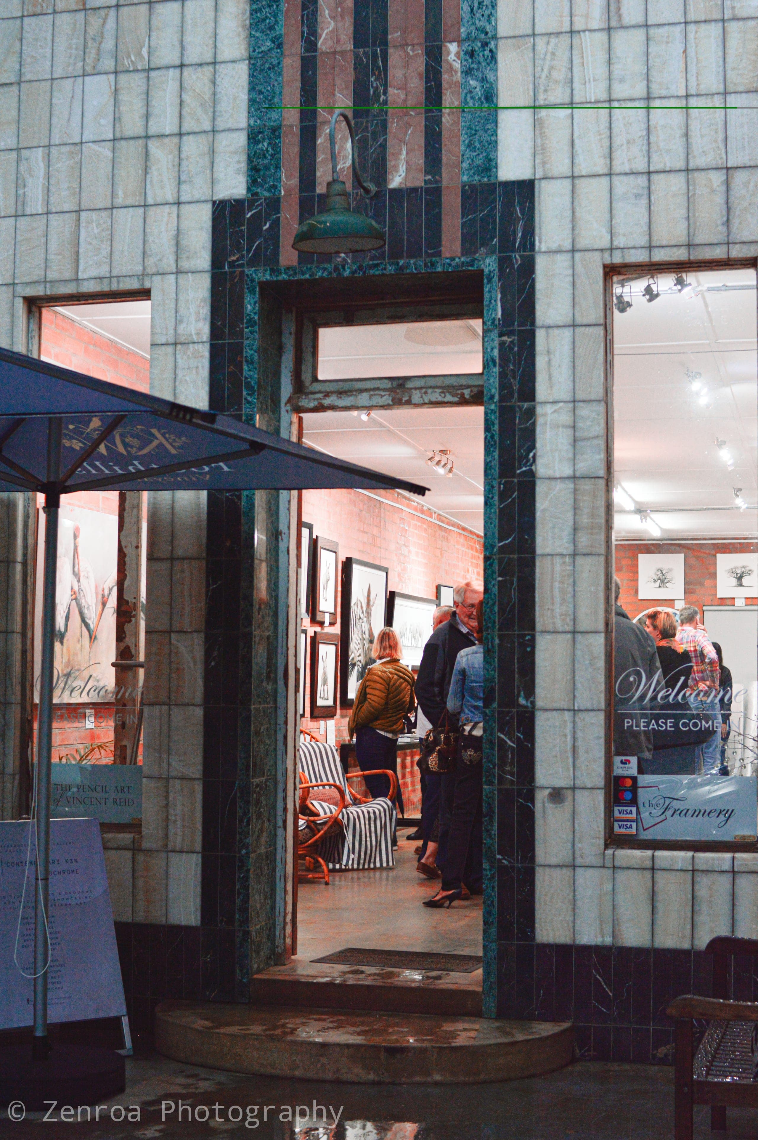 Gallery entrance with a tiled doorway at night