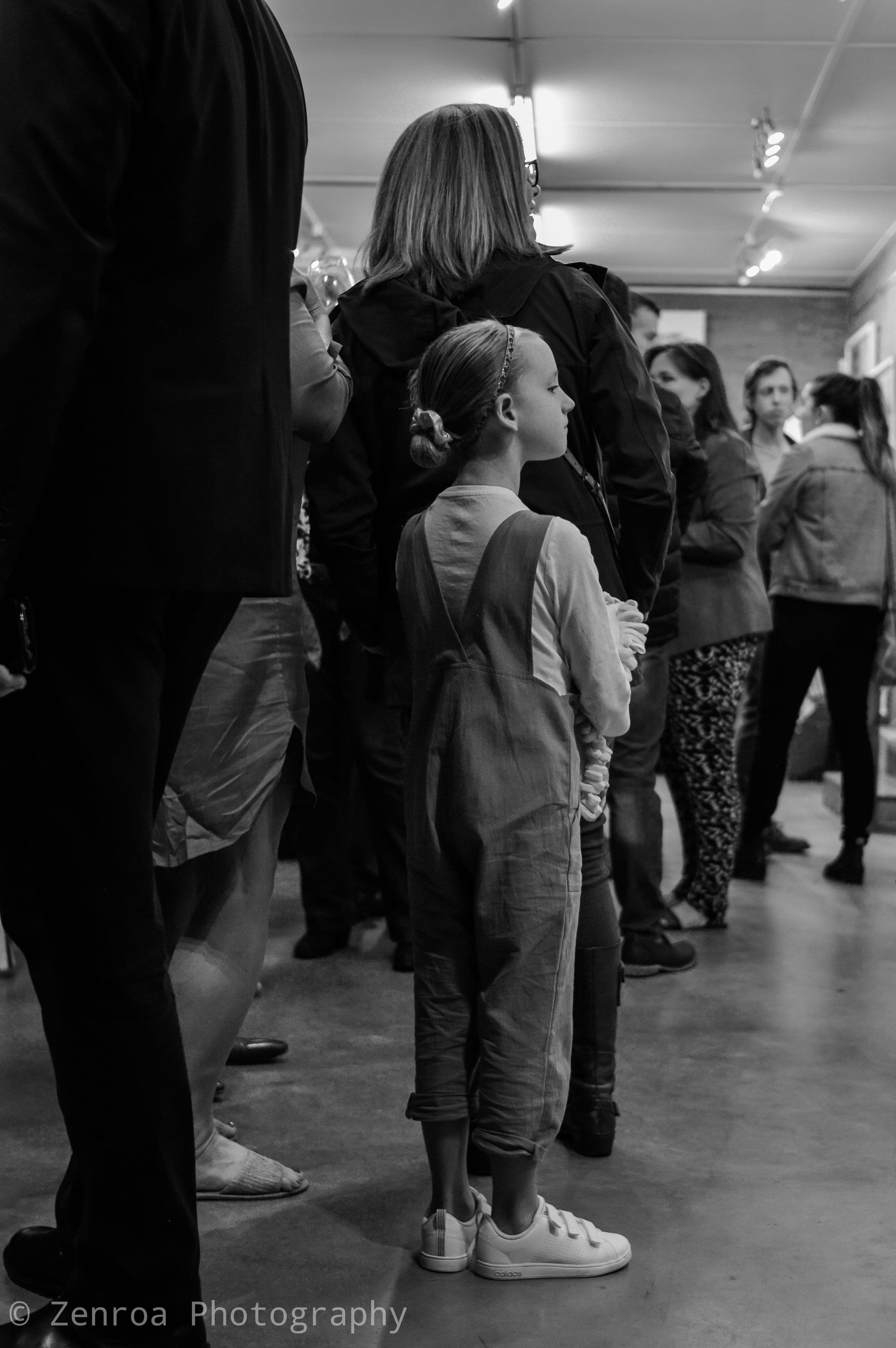 Visitors walking through the exhibition
